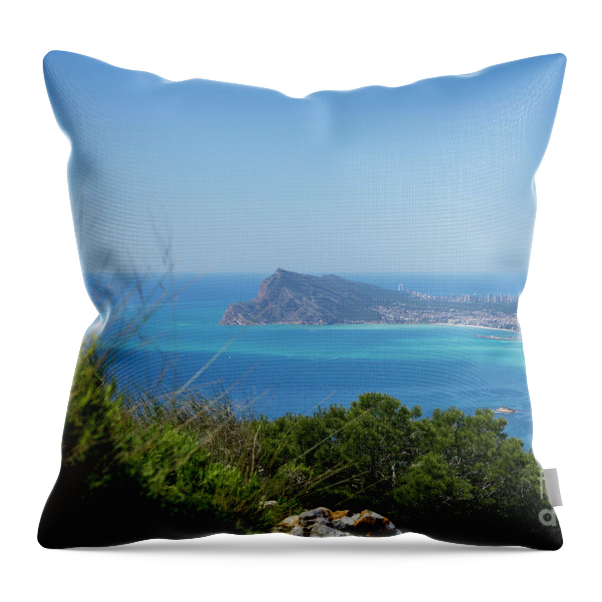 Spain Throw Pillow featuring the photograph View of the coast and the Mediterranean sea in Benidorm by Adriana Mueller