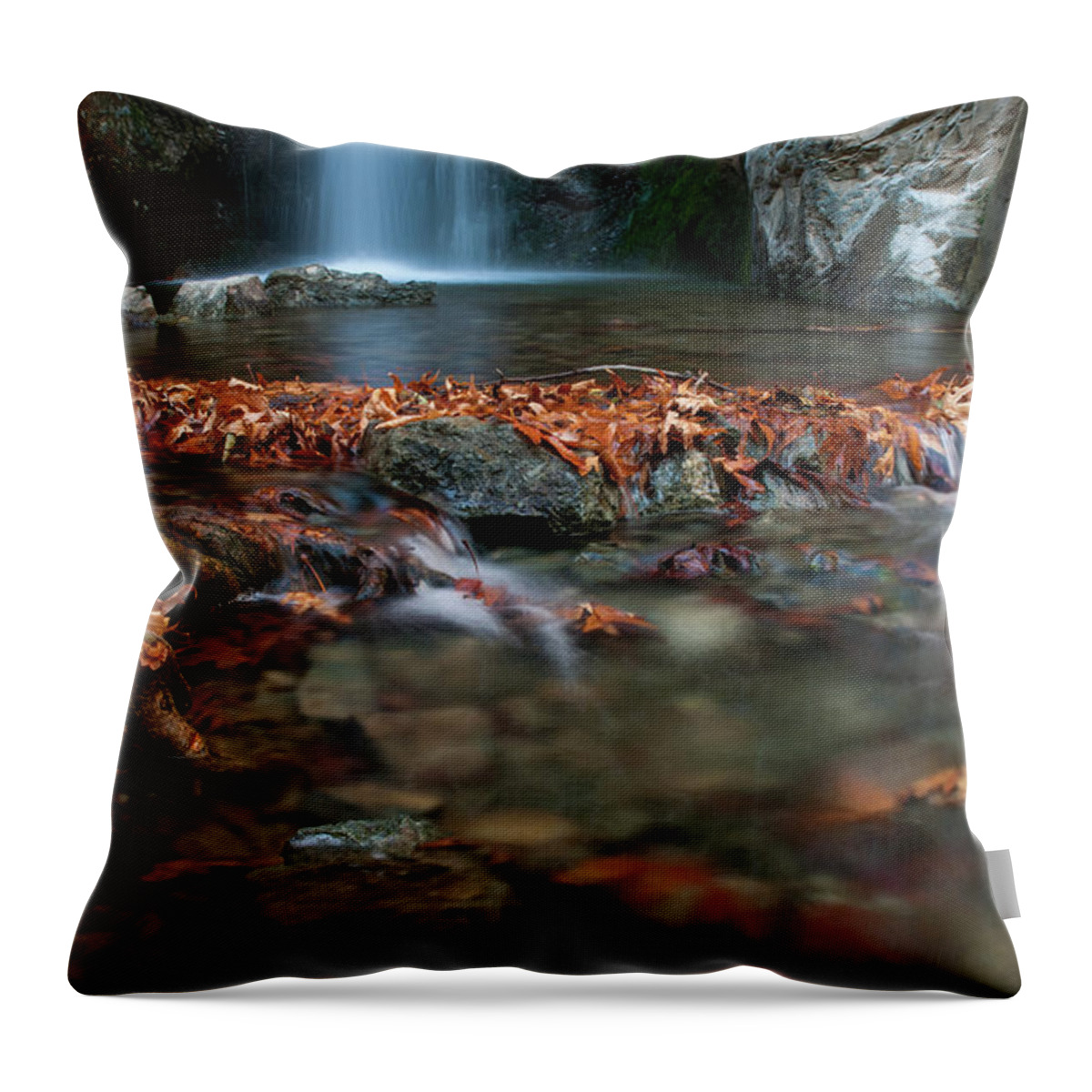 Troodos Throw Pillow featuring the photograph Waterfall and river flowing with maple leaves on the rocks on the river in Autumn by Michalakis Ppalis