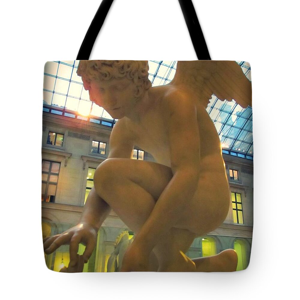 Cupid Playing With A Butterfly Tote Bag featuring the photograph Cupid Playing with a Butterfly - Louvre Museum Paris by Marianna Mills