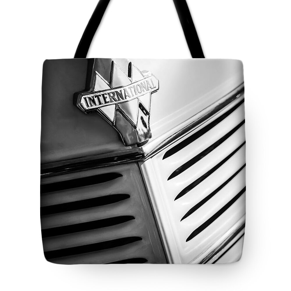 1940 International D-2 Station Wagon Grille Emblem Tote Bag featuring the photograph 1940 International D-2 Station Wagon Grille Emblem by Jill Reger