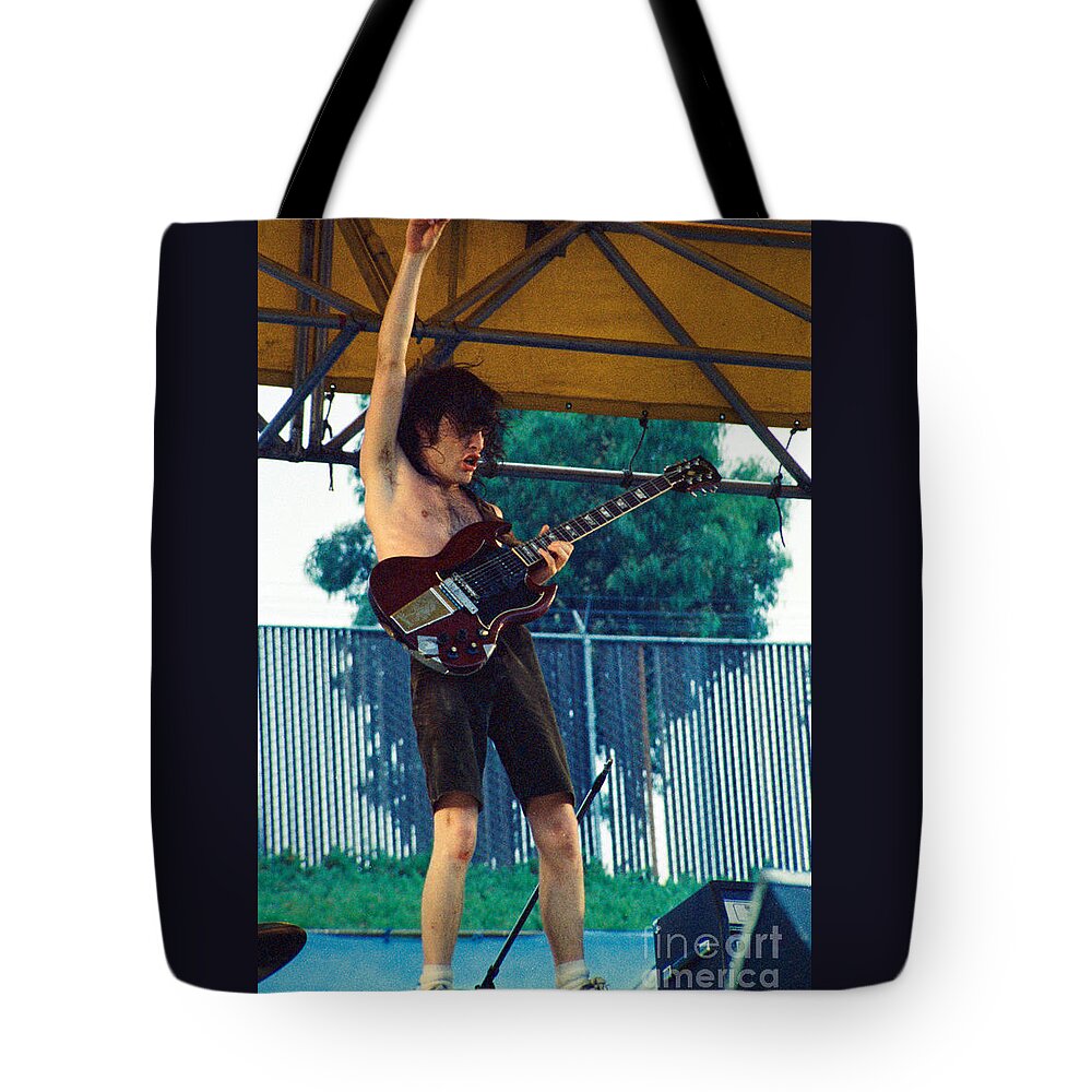 Angus Young Tote Bag featuring the photograph Angus Young of A C D C at Day on the Green Monsters of Rock - July 1979 by Daniel Larsen