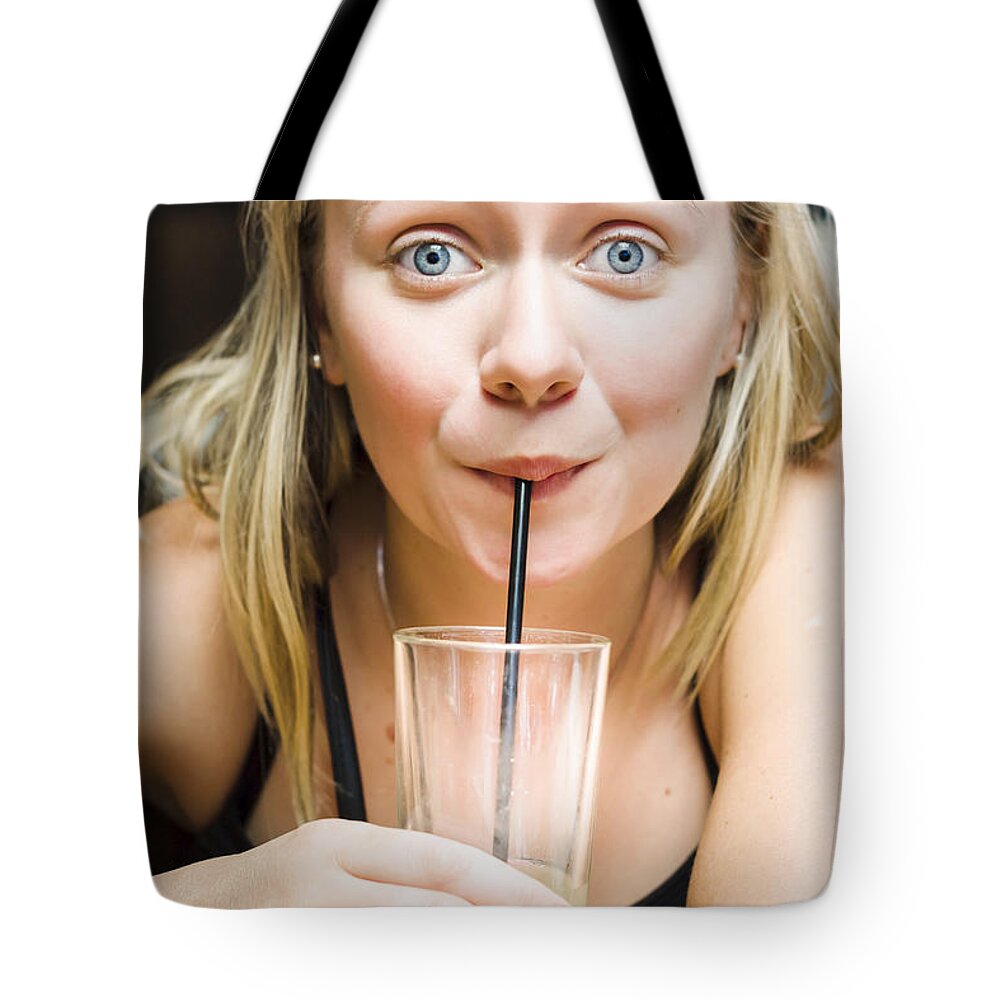 Soda Tote Bag featuring the photograph Beautiful blonde woman drinking soda soft drink #1 by Jorgo Photography