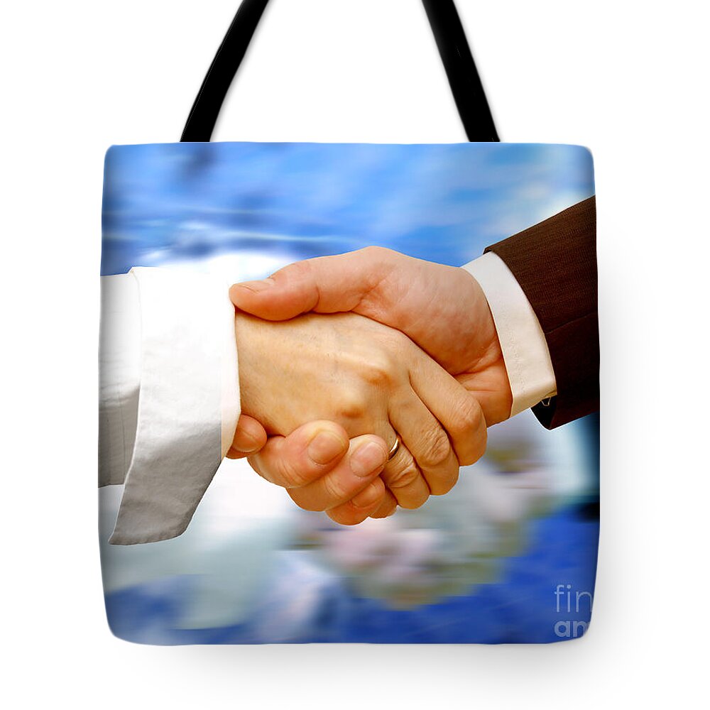 Agree Tote Bag featuring the photograph Business handshake #1 by Michal Bednarek