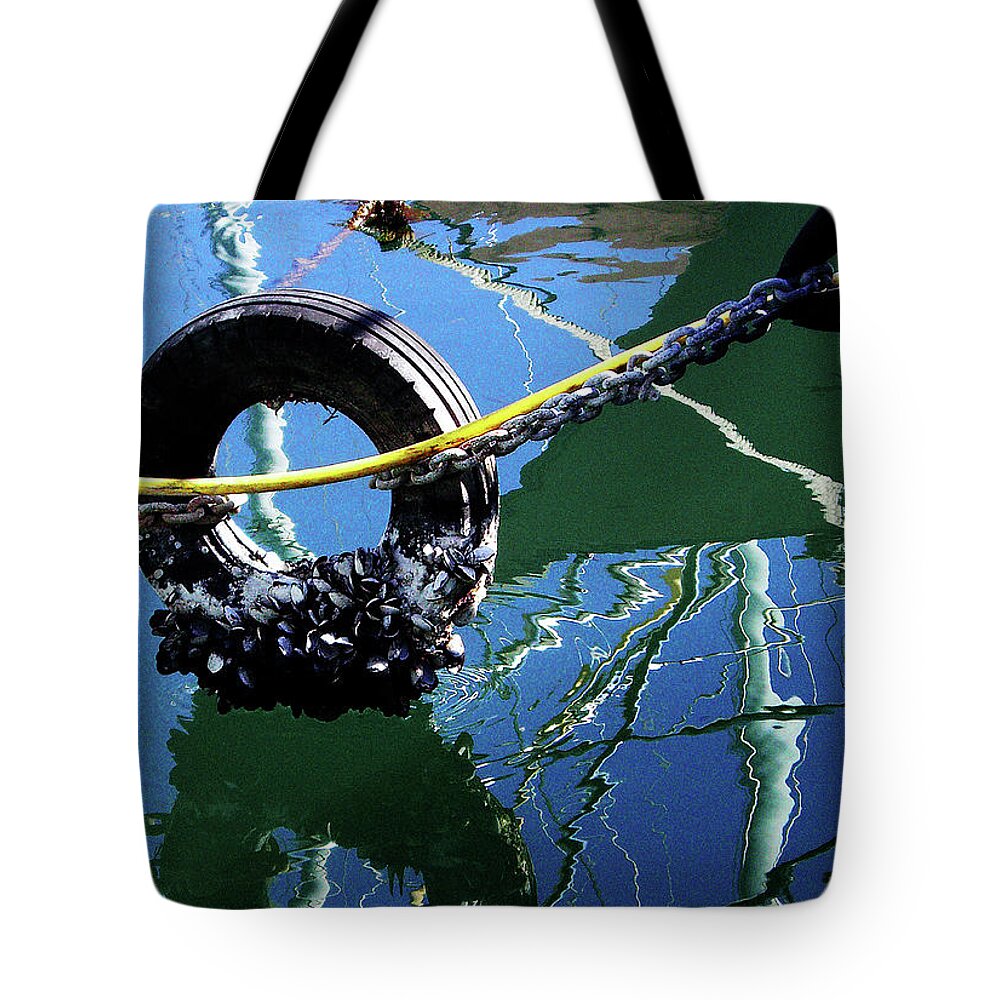 The Tote Bag featuring the photograph Clams On A Tire #1 by Xueling Zou