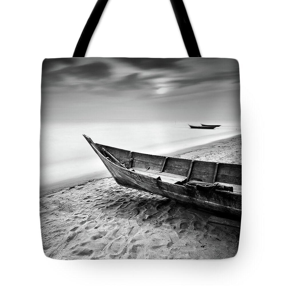 Tranquility Tote Bag featuring the photograph Fisherman Boat At Beach In Black And by Photography By Azrudin