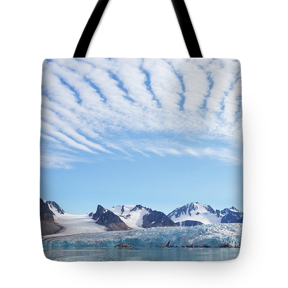 Scenics Tote Bag featuring the photograph Glaciers Tumble Into The Sea In The #1 by Anna Henly