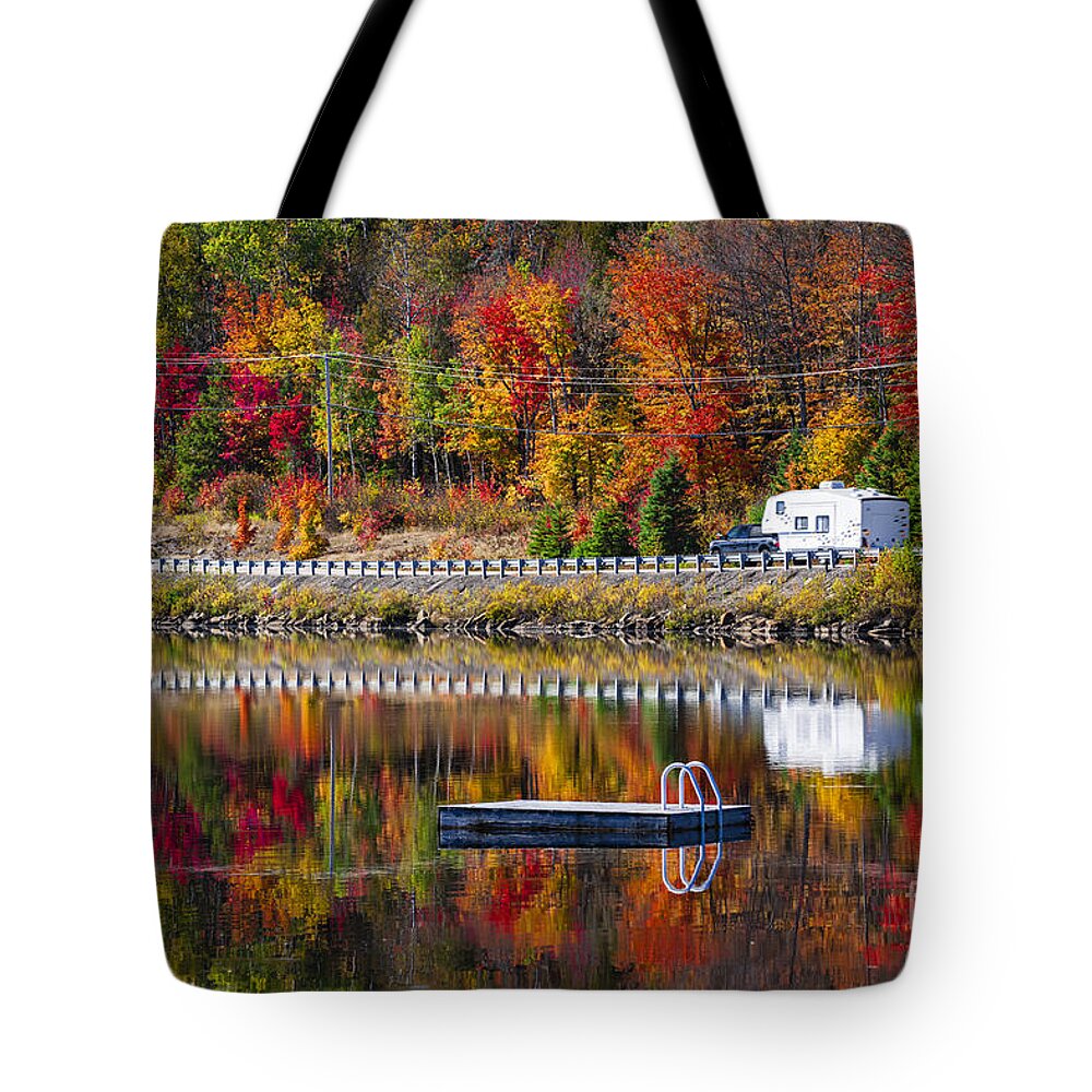 Forest Tote Bag featuring the photograph Highway through fall forest 3 by Elena Elisseeva