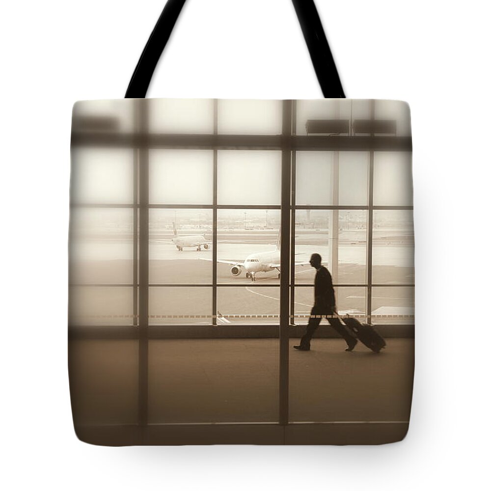 Lone Tote Bag featuring the photograph Lone Traveler #3 by Valentino Visentini