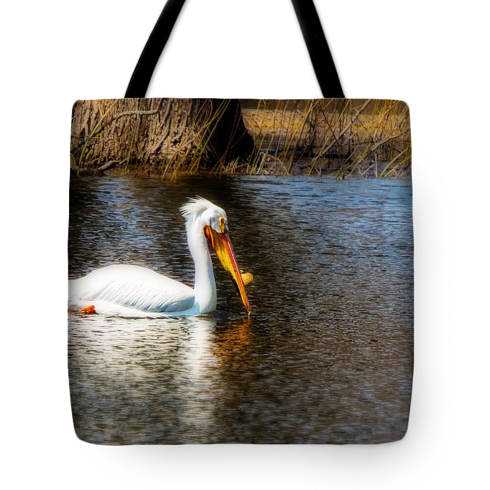 Pelican Bird Water Lake Pond River Beak Feather Feathers Plume Spring Summer Sun Ripple Water Tree Branch Twig Grass Reeds Knob Swim Blue White Yellow Red Orange Impressionist Impressionism Wall Hang Decorate Sell Real Estate Stage Staging Pelecanus Erythrorhynchos American White Pelican Redecorate Tote Bag featuring the photograph Pelican #1 by Tom Gort