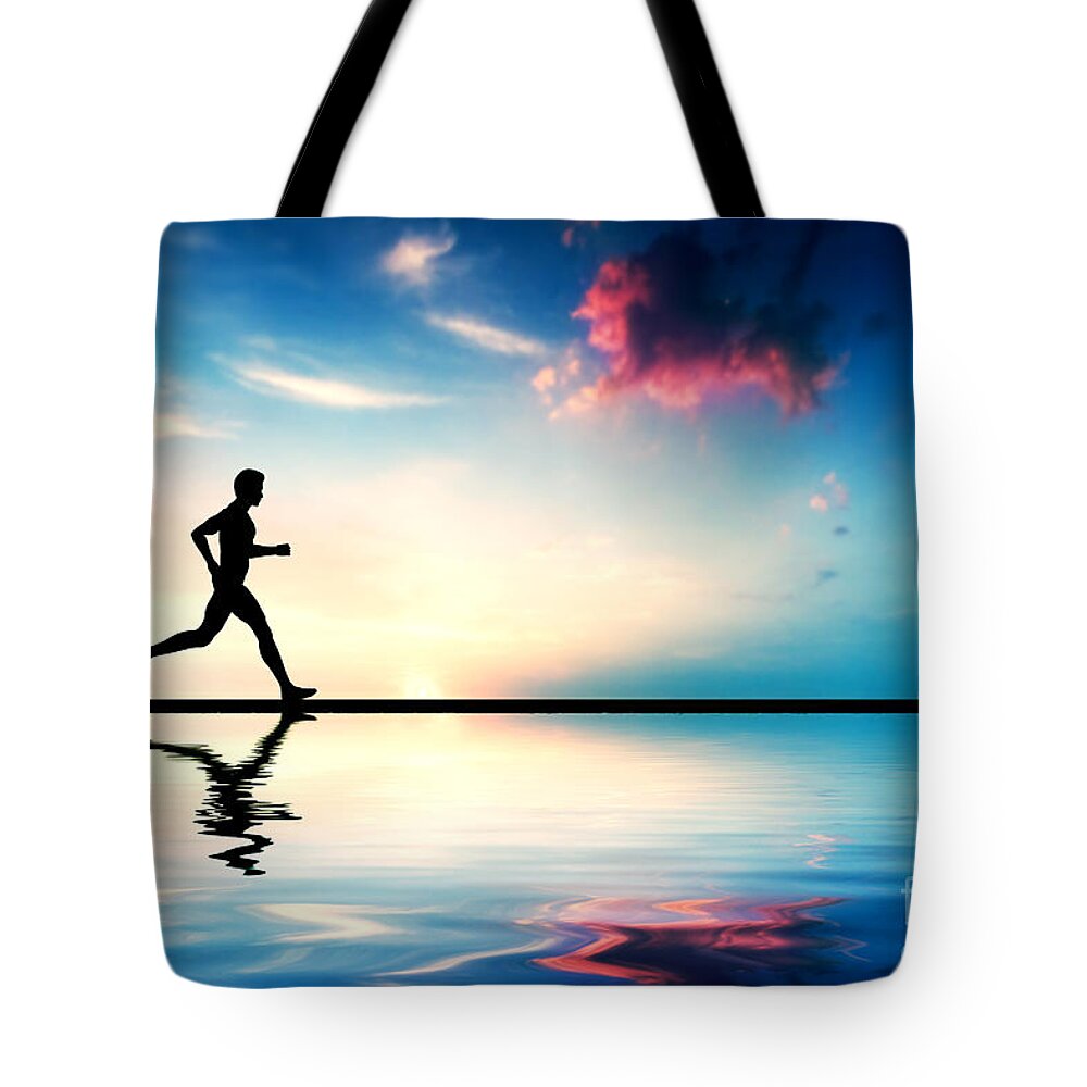 Jogging Tote Bag featuring the photograph Silhouette of man running at sunset #1 by Michal Bednarek