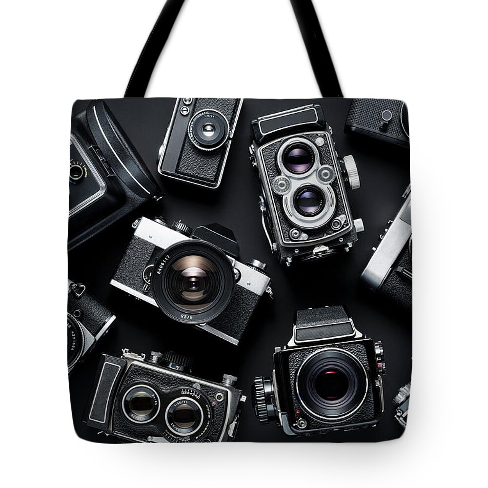 Black Background Tote Bag featuring the photograph Vintage Cameras #1 by Jorg Greuel