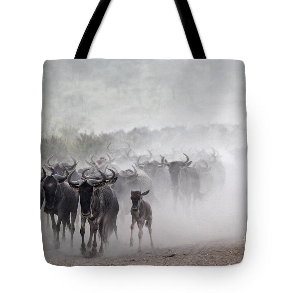 Power Tote Bag featuring the photograph Wildebeest migration #1 by Gilad Flesch