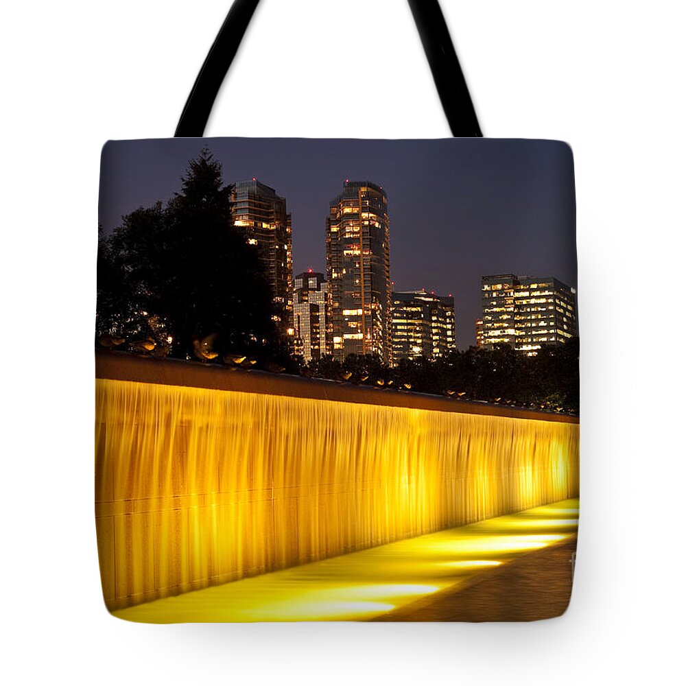 Bellevue Tote Bag featuring the photograph Bellevue skyline from city park with fountain and waterfall at s #14 by Jim Corwin