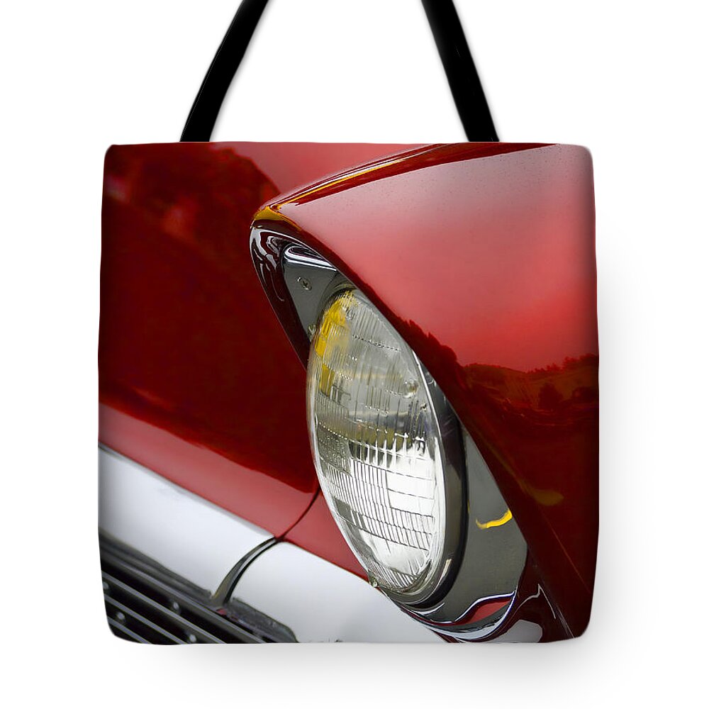 1956 Tote Bag featuring the photograph 1956 Chevrolet Headlamp by Carol Leigh