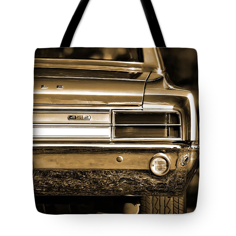 Red Tote Bag featuring the photograph 1965 Olds 442 by Gordon Dean II