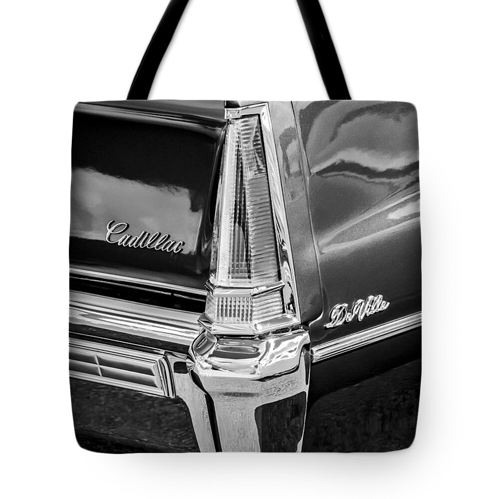 1969 Cadillac Deville Taillight Emblems Tote Bag featuring the photograph 1969 Cadillac DeVille Taillight Emblems -0890bw by Jill Reger