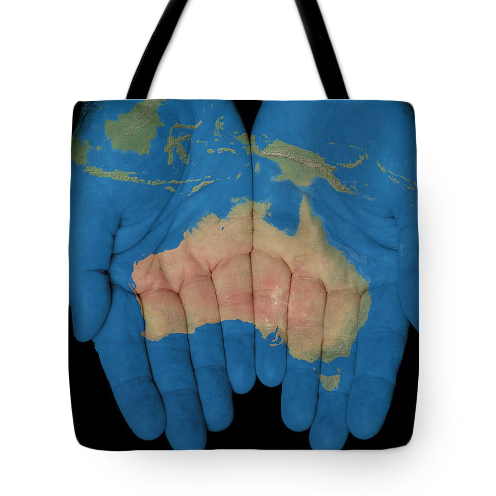 World Map Tote Bag featuring the photograph Australia In Our Hands by Jim Vallee