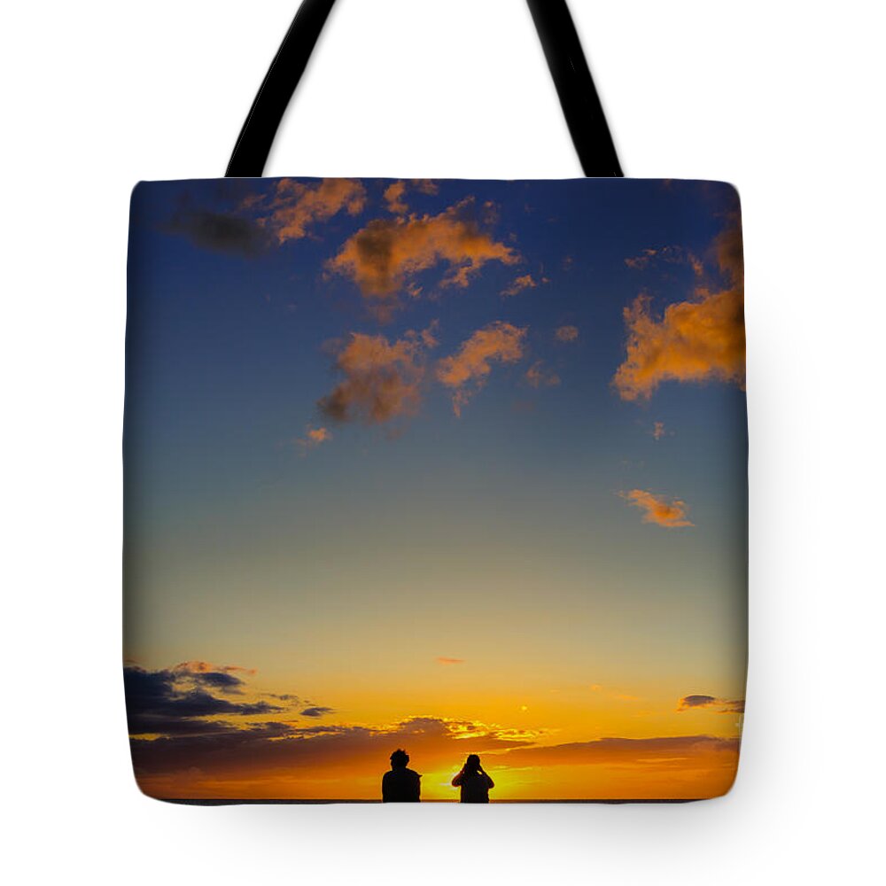 Hawaii Tote Bag featuring the photograph Couple watching the sunset on a beach in Maui Hawaii USA #2 by Don Landwehrle