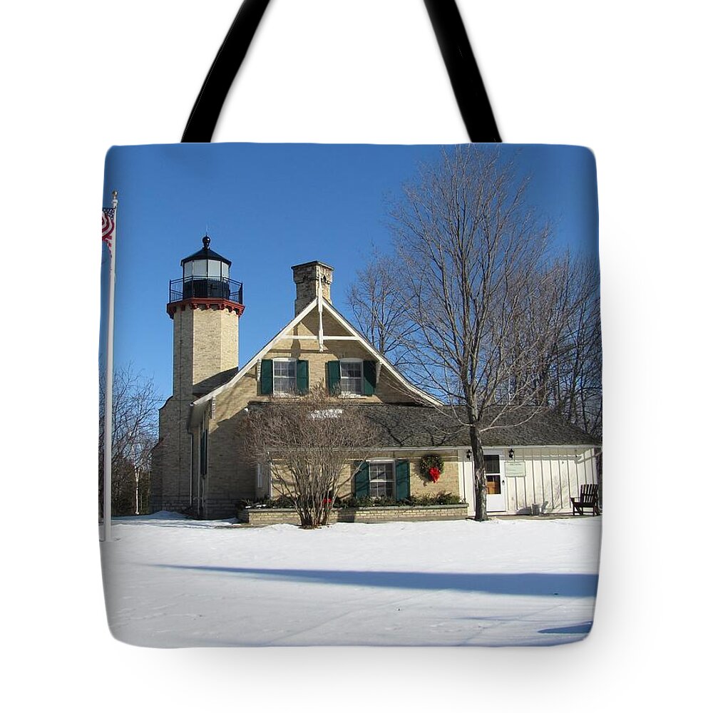 Winter Tote Bag featuring the photograph McGulpin Point Lighthouse in Winter by Keith Stokes