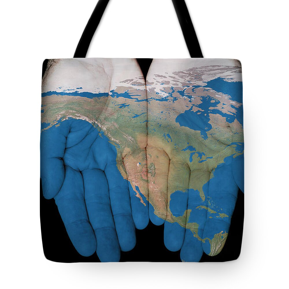 World Map Tote Bag featuring the photograph North America In Our Hands by Jim Vallee