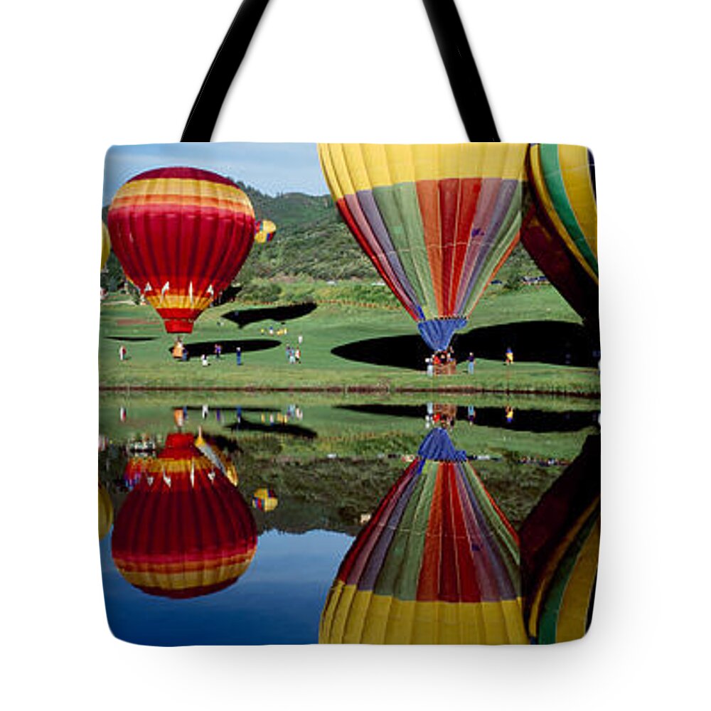 Photography Tote Bag featuring the photograph Reflection Of Hot Air Balloons #2 by Panoramic Images