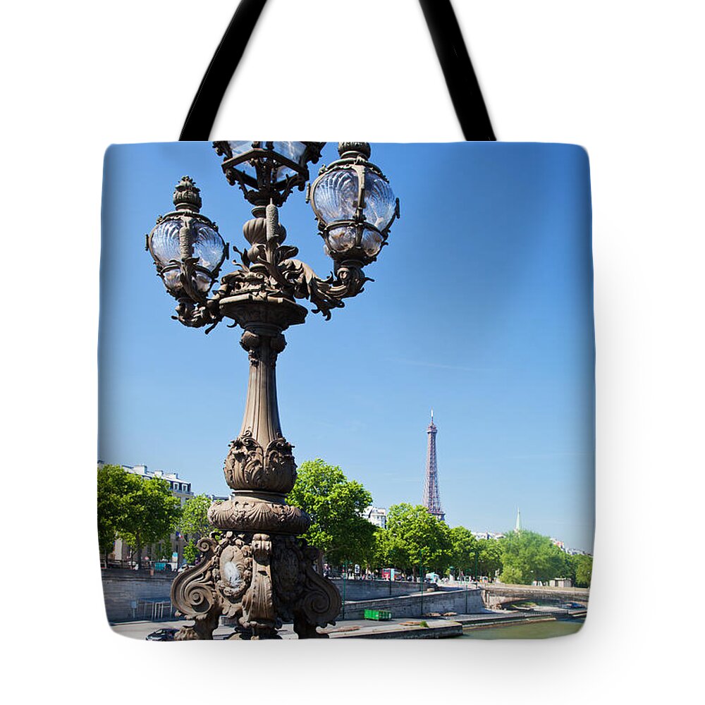 Paris Tote Bag featuring the photograph Eiffel Tower and bridge on Seine river in Paris #3 by Michal Bednarek