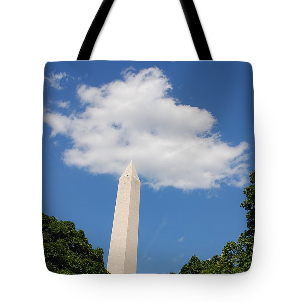 Washington Tote Bag featuring the photograph Obelisk Rises Into the Clouds by Kenny Glover