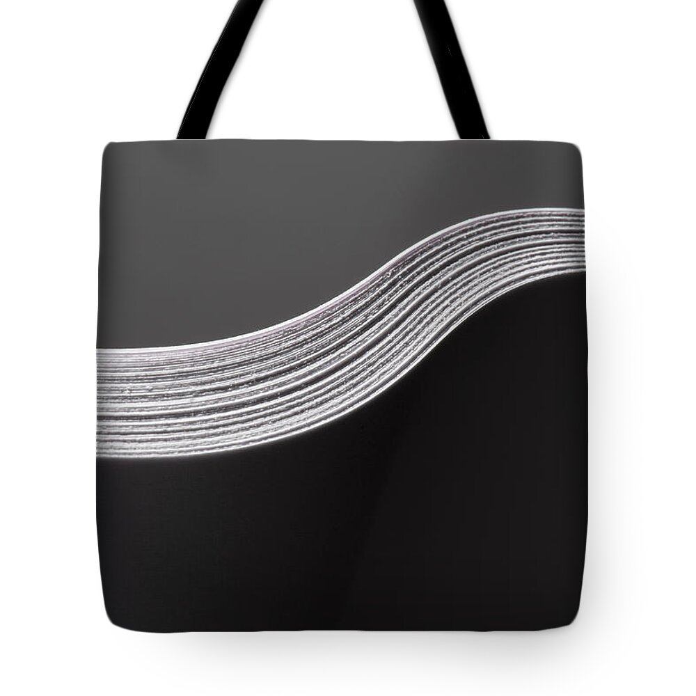 Simplicity Tote Bag featuring the photograph Close Up Detail Of Multiple Sheets Of #5 by Pm Images