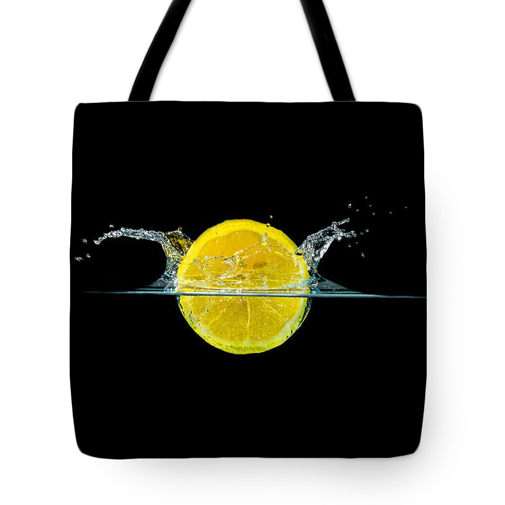 Beverage Tote Bag featuring the photograph Splashing Lemon #5 by Peter Lakomy