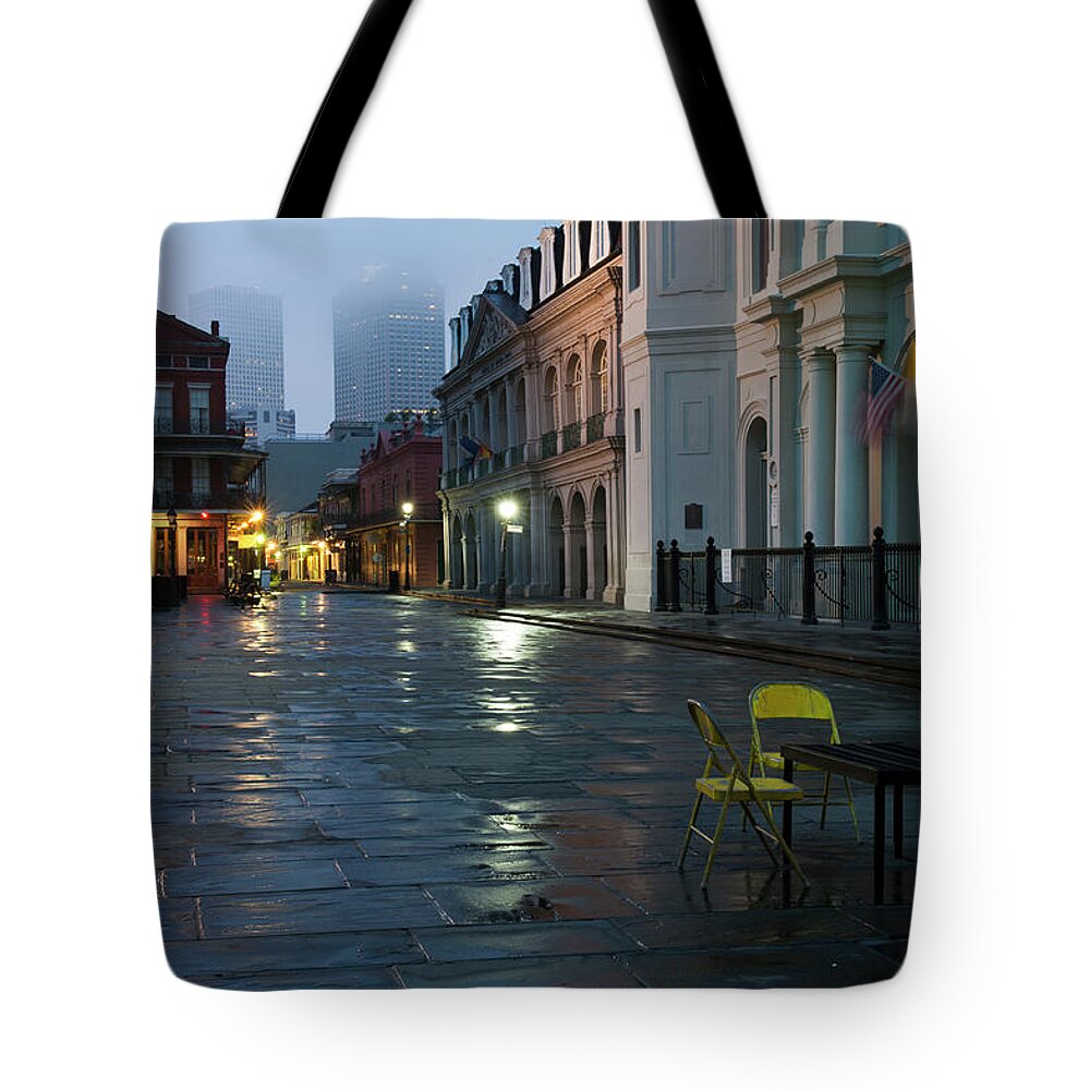 Dawn Tote Bag featuring the photograph A Courtyard At Dusk With A Card Table by Karenmassier