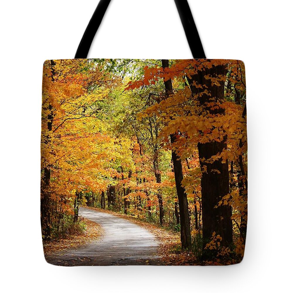 Woodland Tote Bag featuring the photograph A Drive through the Woods by Bruce Bley