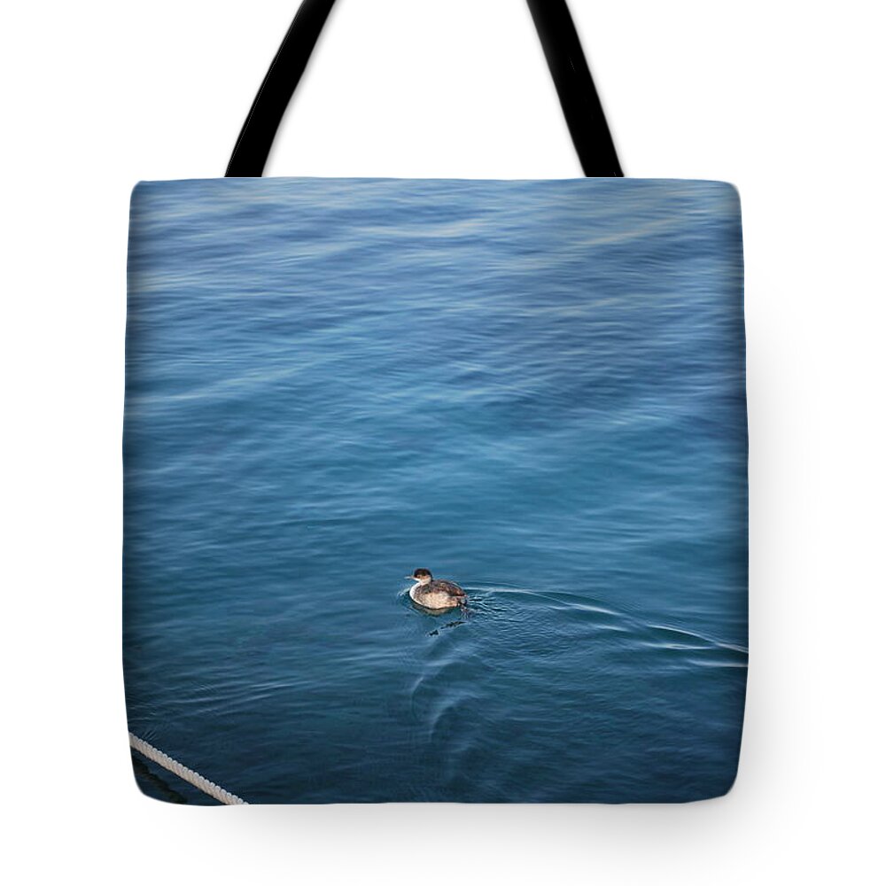 Duck Tote Bag featuring the photograph A Duck by George Katechis