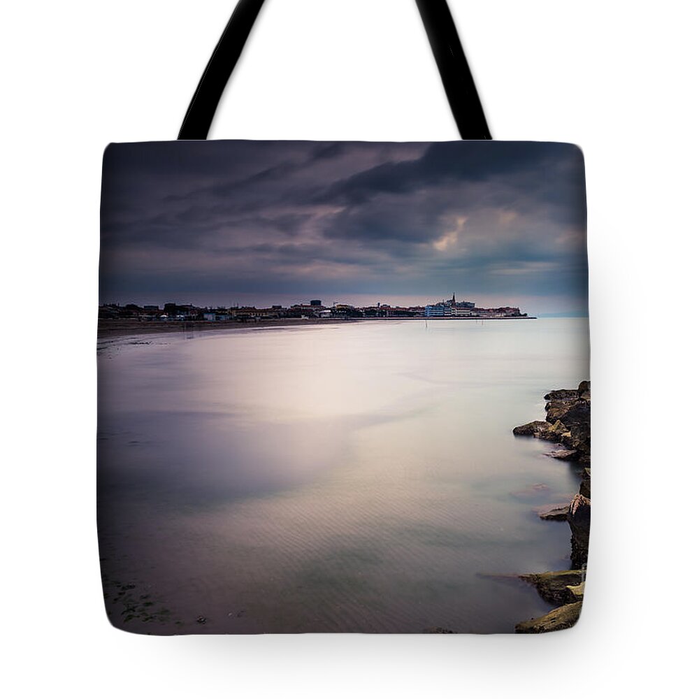 Adria Tote Bag featuring the photograph a look at Grado by Hannes Cmarits