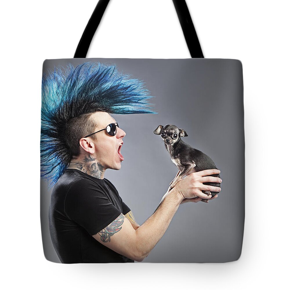 Wild Tote Bag featuring the photograph A Man With A Blue Mohawk Yells At His by Leah Hammond