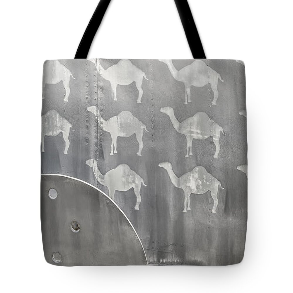 Aircraft Kill Tags Tote Bag featuring the photograph A pack of camels by Gary Warnimont