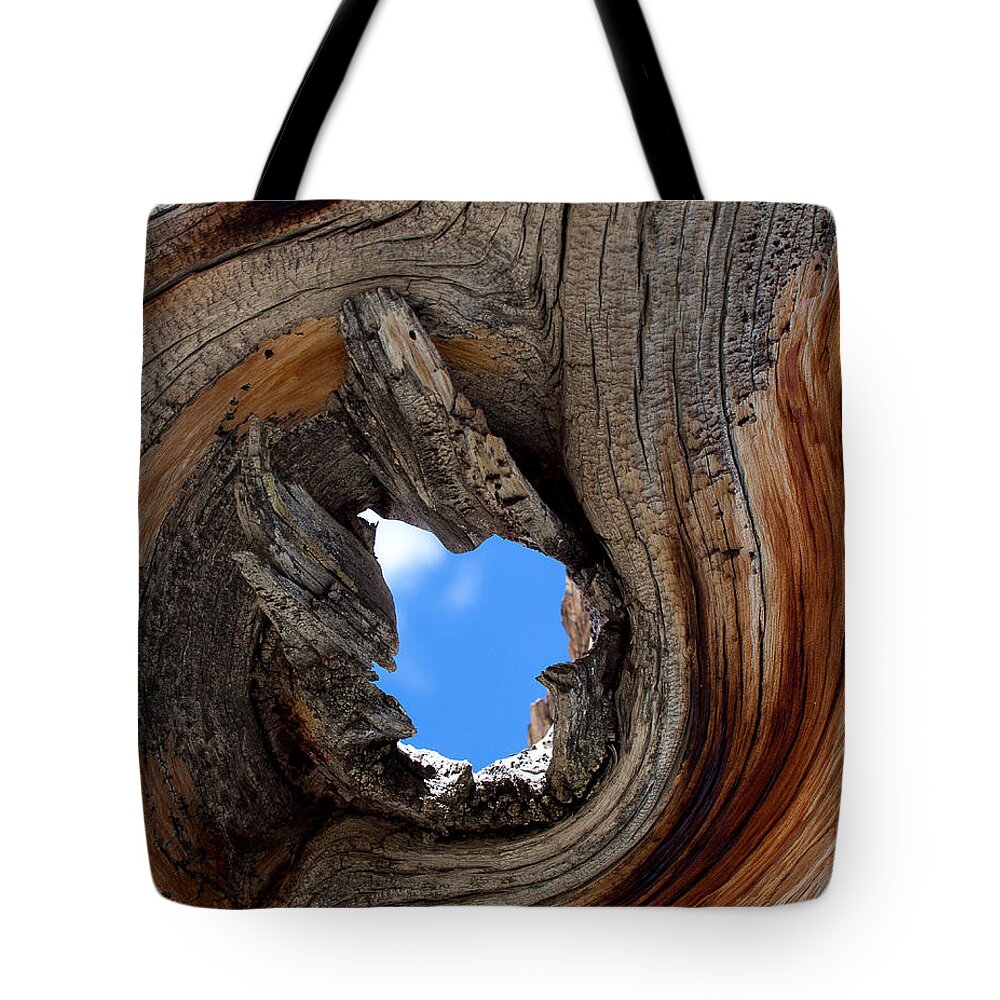 Blue Sky Print Tote Bag featuring the photograph A Patch of Blue by Jim Garrison