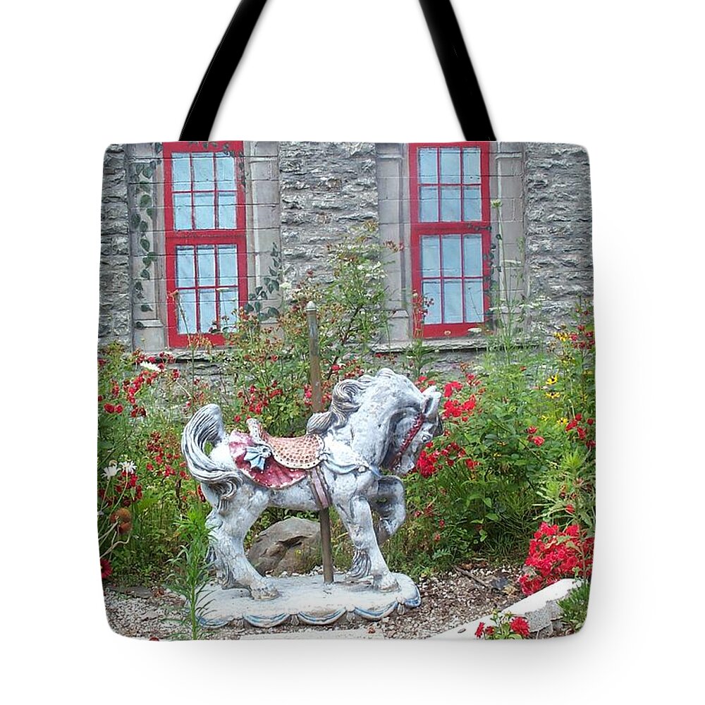 Carousel Pony Tote Bag featuring the photograph A Treasure in a Garden by Barbara McDevitt
