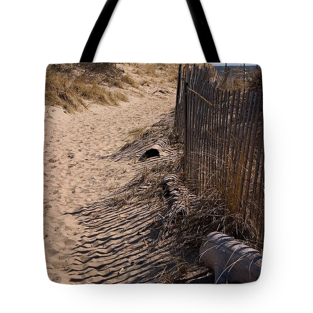 Beach Retaining Fence Tote Bag featuring the photograph A walk to the beach by Jeff Folger