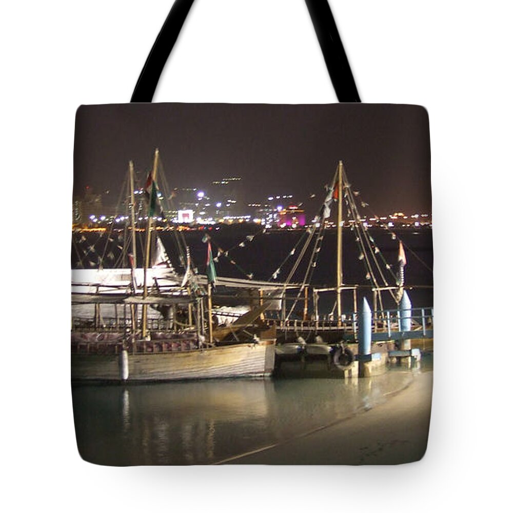 Abu Dhabi Tote Bag featuring the photograph Abu Dhabi at night by Andrea Anderegg