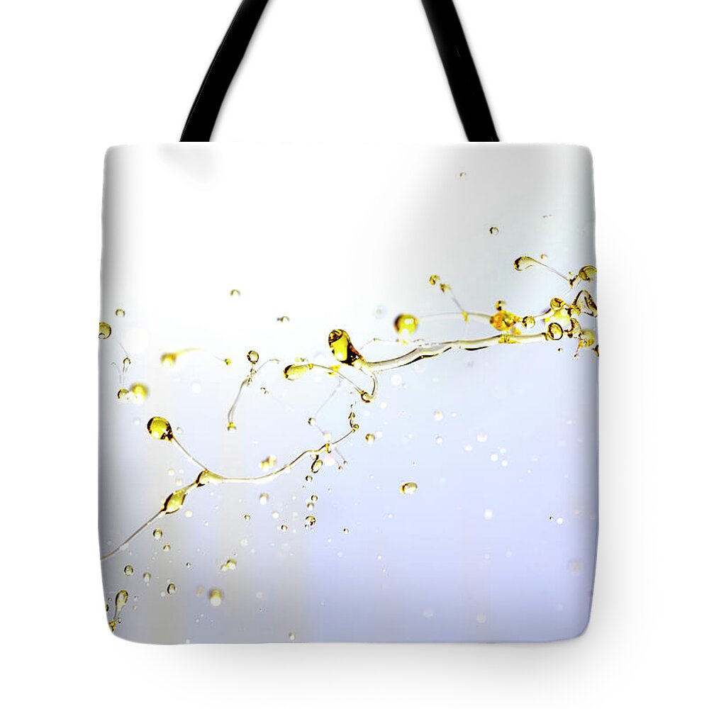 Motor Oil Tote Bag featuring the photograph Active Oil Splash by Yaorusheng
