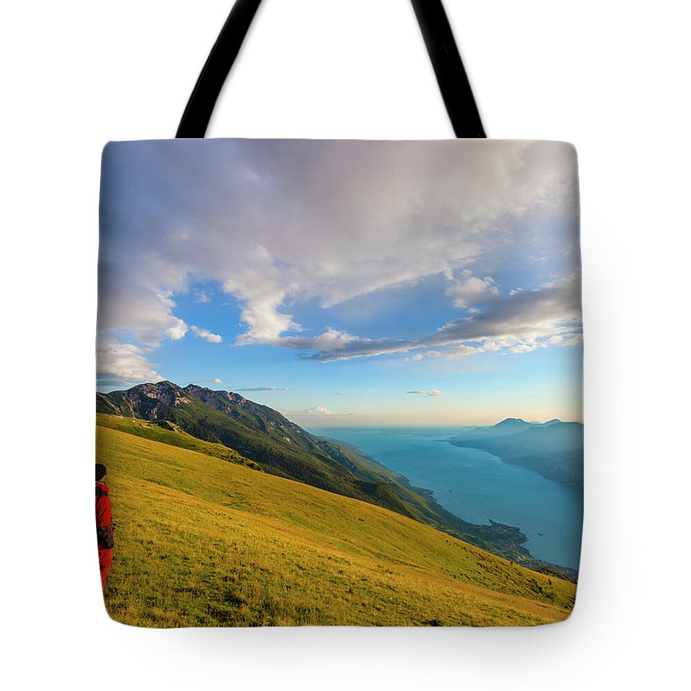 Eco Tourism Tote Bag featuring the photograph Admiring Lake Garda by Flavio Vallenari