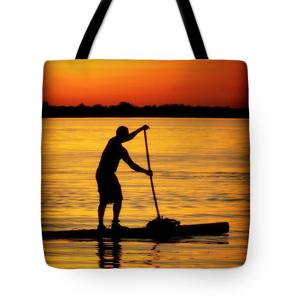 Paddle Boarding Tote Bag featuring the photograph Alone With The Sun by Karen Wiles