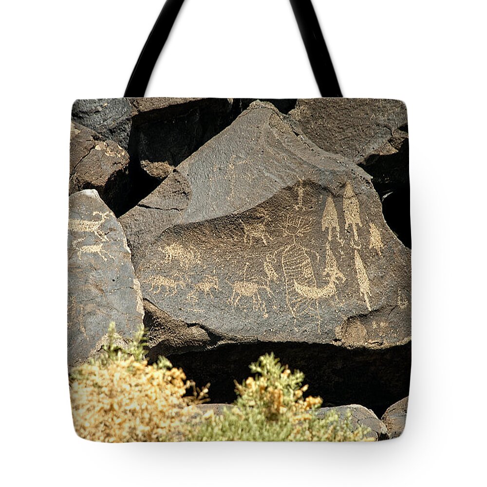 Petroglyph Tote Bag featuring the photograph Arrowhead petroglyphs by John Bennett