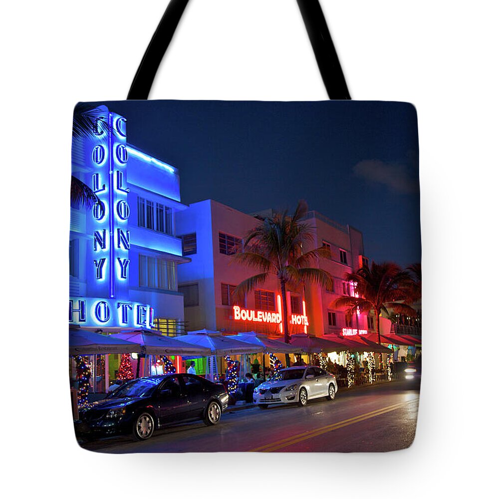 Nightclub Tote Bag featuring the photograph Art Deco Illuminated Buildings At Night by Barry Winiker
