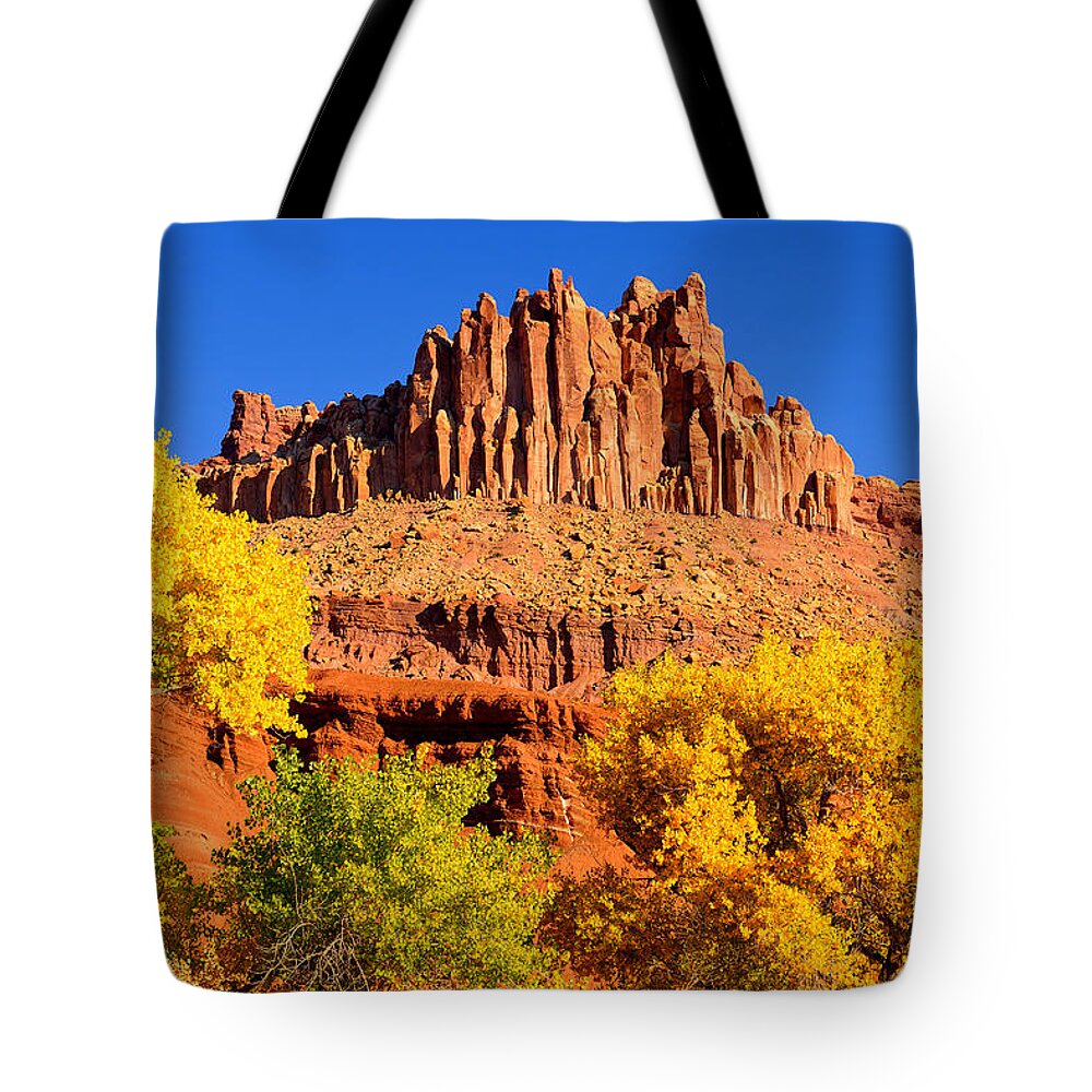 Capitol Reef National Park Tote Bag featuring the photograph Autumn Beneath the Castle by Greg Norrell