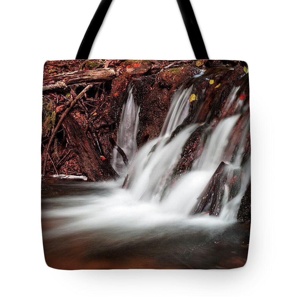 Water's Edge Tote Bag featuring the photograph Autumn Waterfall by Yorkfoto