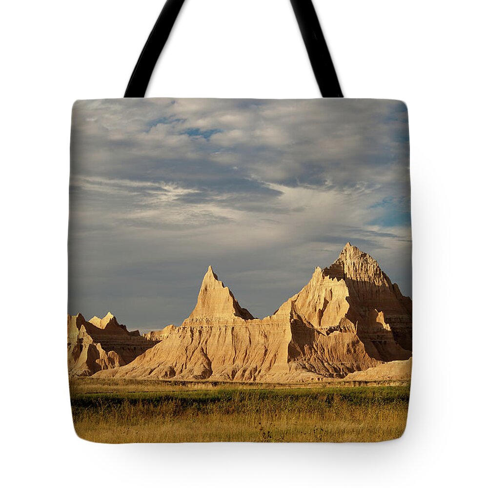 Tranquility Tote Bag featuring the photograph Badlands Landscape In Late Day Light by Karen Desjardin