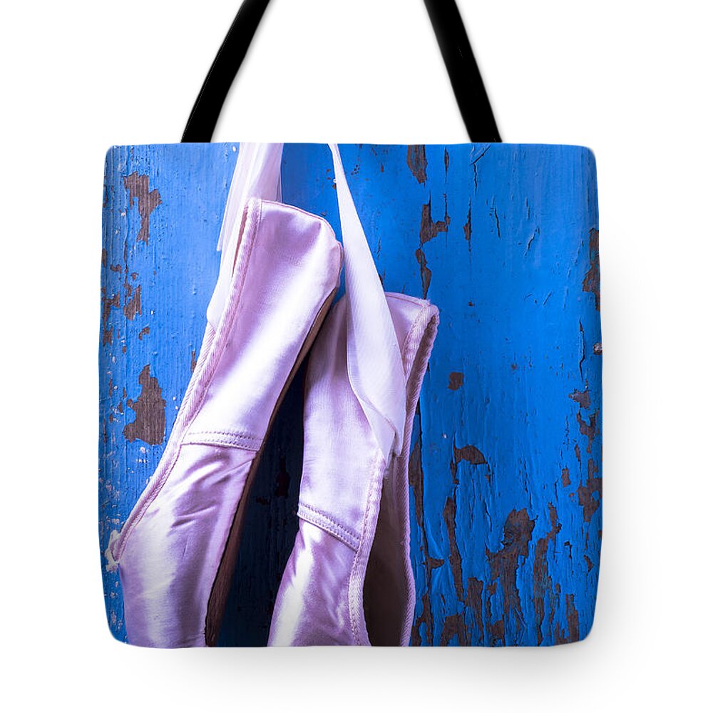 Ballet Shoes Shoe Tote Bag featuring the photograph Ballet shoes on blue wall by Garry Gay