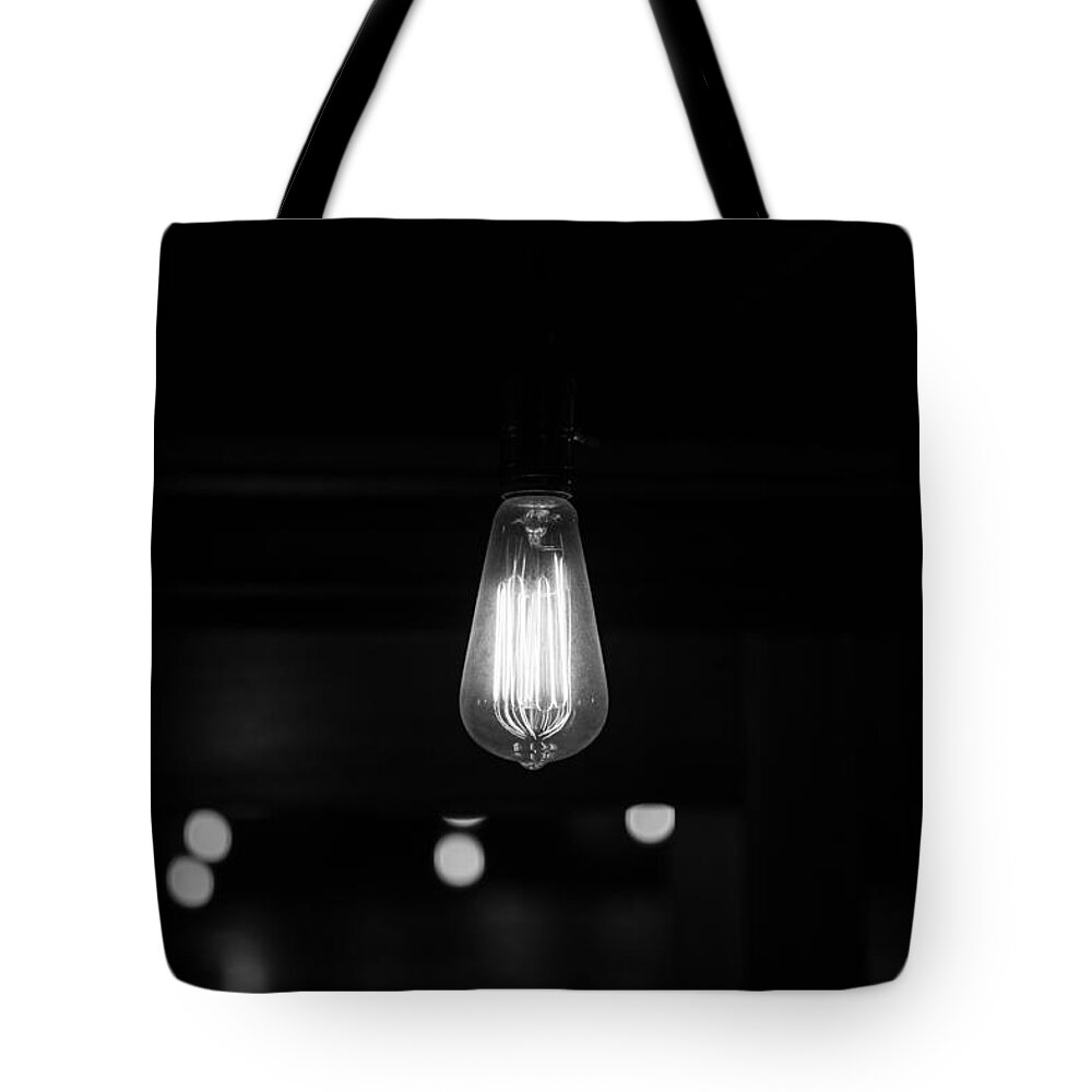 Bare Bulb Tote Bag featuring the photograph Bare Bulb by Allan Morrison
