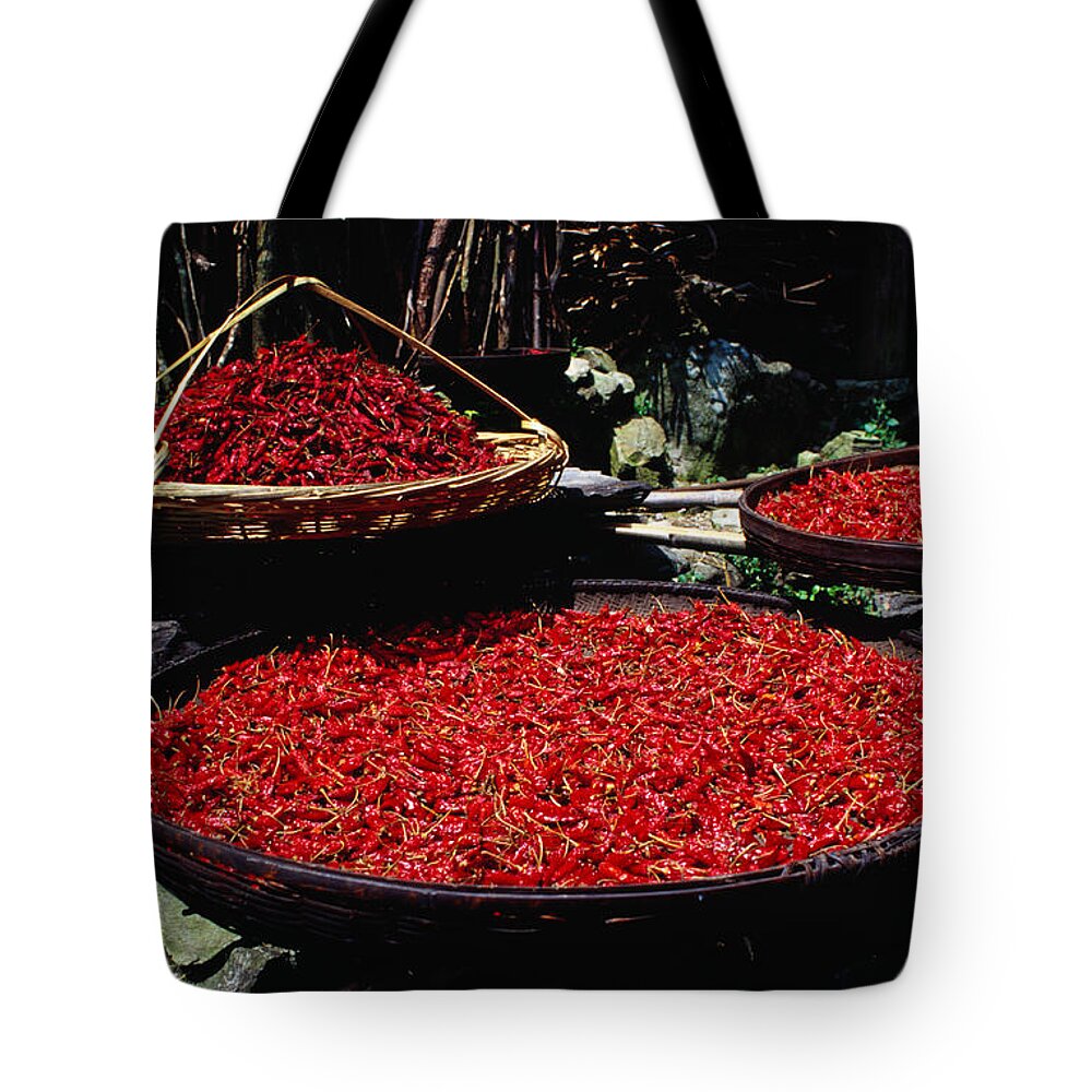 Spice Tote Bag featuring the photograph Baskets Of Red Chillies In The Village by Richard I'anson